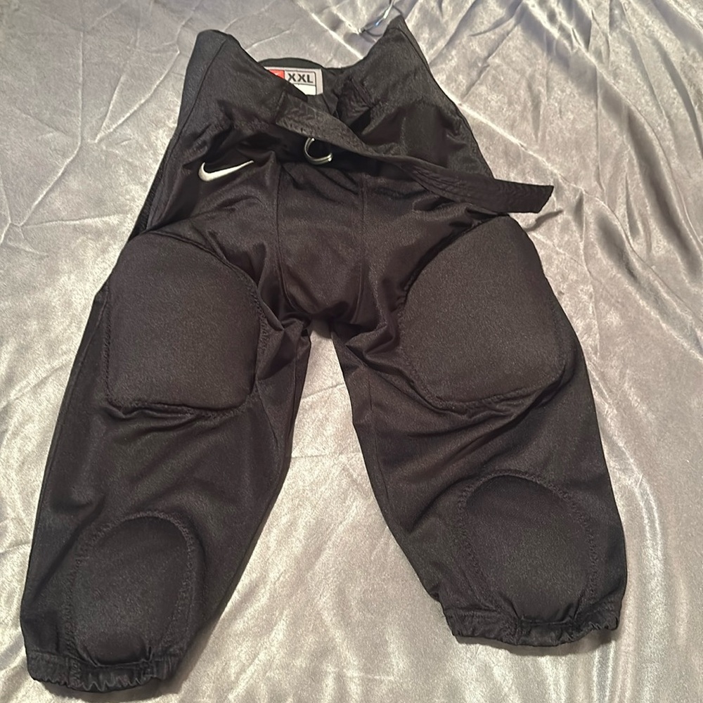 Nike padded football pants new without tags. Boys XXL